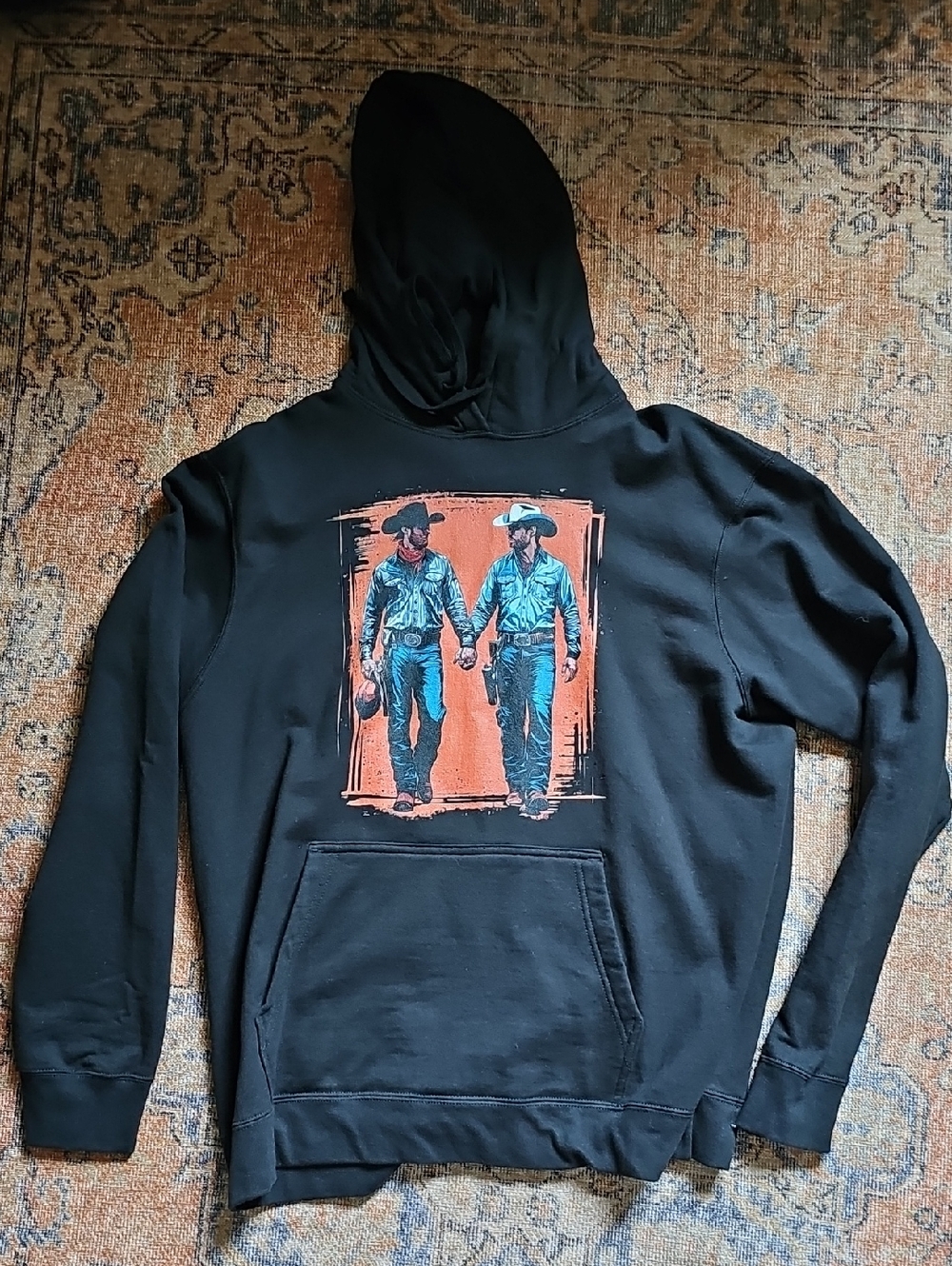 Black Hoodie with Orange Panel & Teal Cowboy Duo Graphic